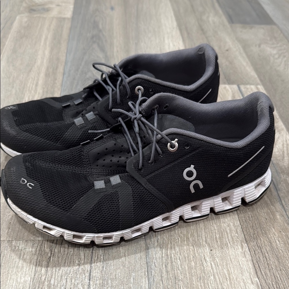 On Running Black and White Athletic Shoes with CloudTec Sole